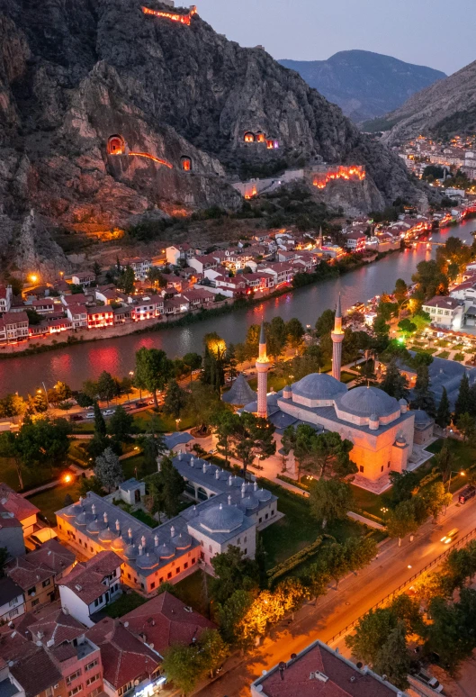 an aerial view of the town of kermen, on the border of mountains