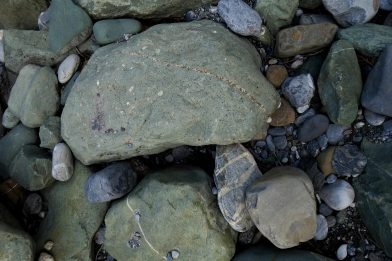 rocks and gravel covered in brown dirt