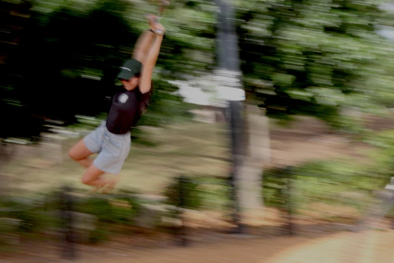 a blurry po of a young man flipping his skateboard