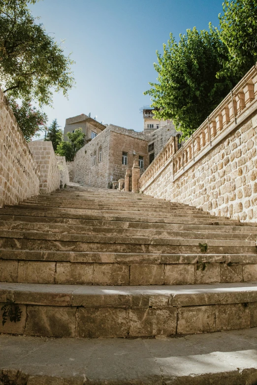 an old set of stairs leading up to some stone buildings