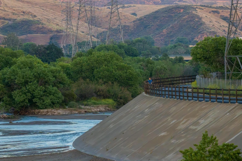 a person riding a bicycle over an enormous ramp