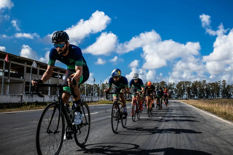 many people ride their bikes in a long line