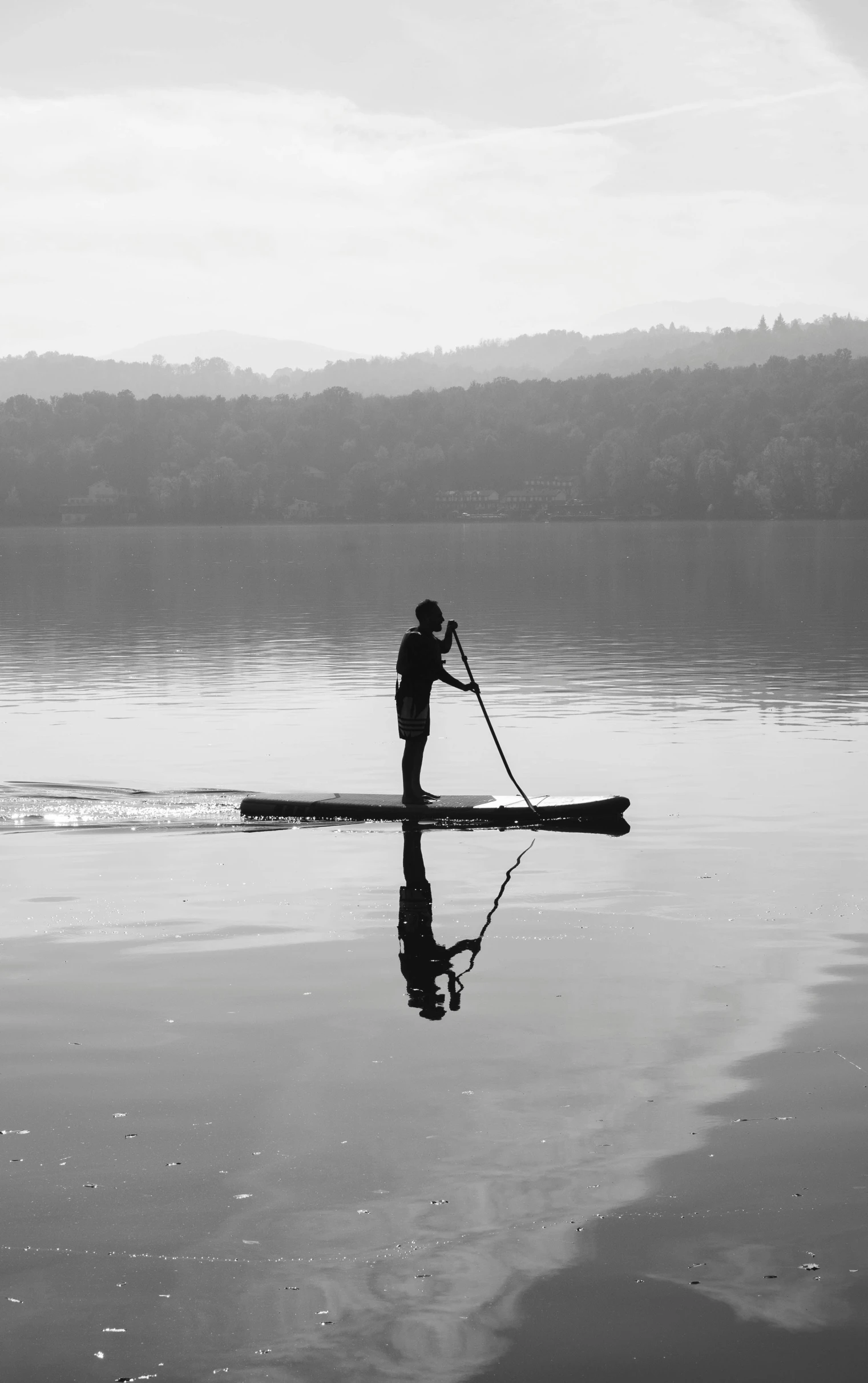 black and white pograph of a man on a boat