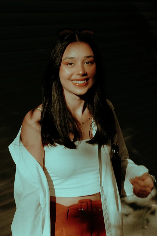 an asian woman with long dark hair smiling