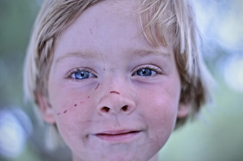  smiling and showing teeth with speckled make up