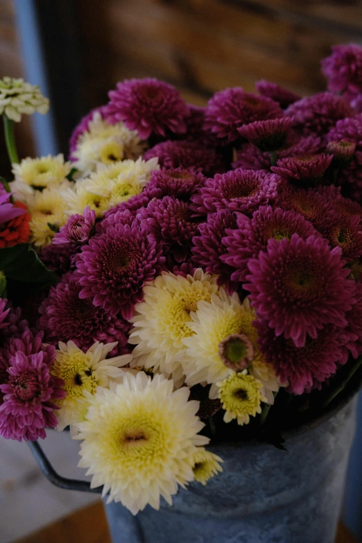 a small pot with some colorful flowers inside