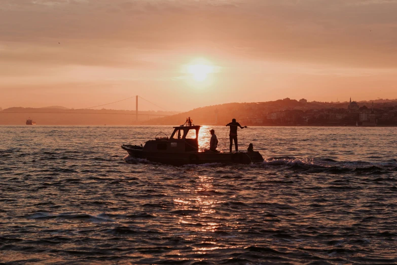 a small boat traveling on top of the ocean