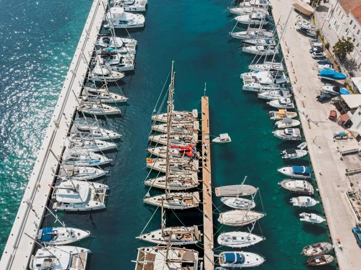 several boats docked at the end of the pier