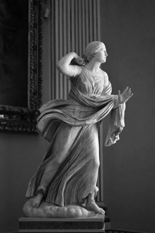 a statue is shown in front of a mirror