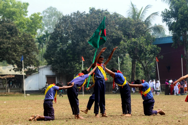 a group of people on a field with flags