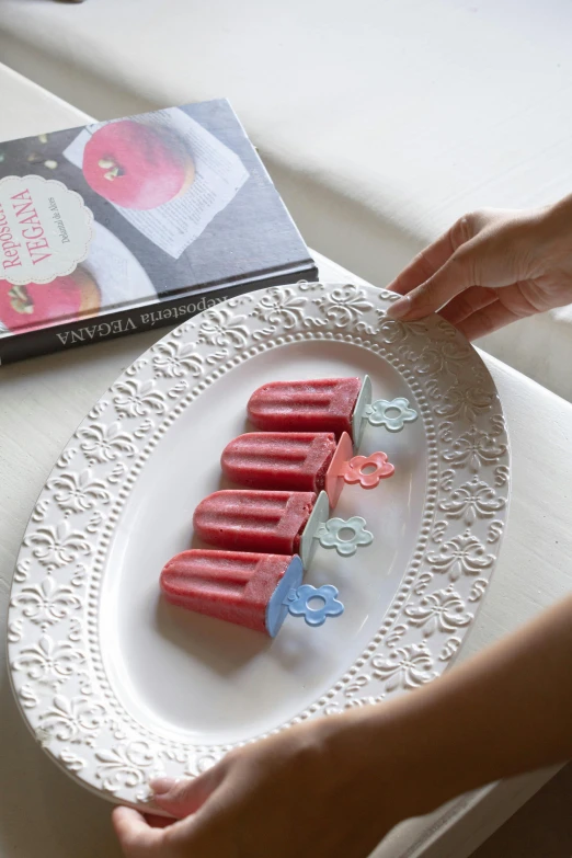 a plate with small candy bars with people made out of them