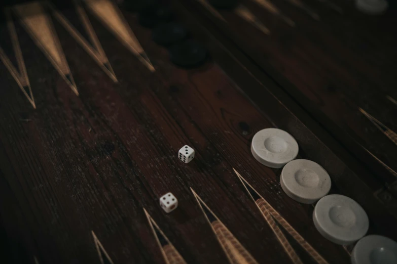 three dices sit next to one another on a table