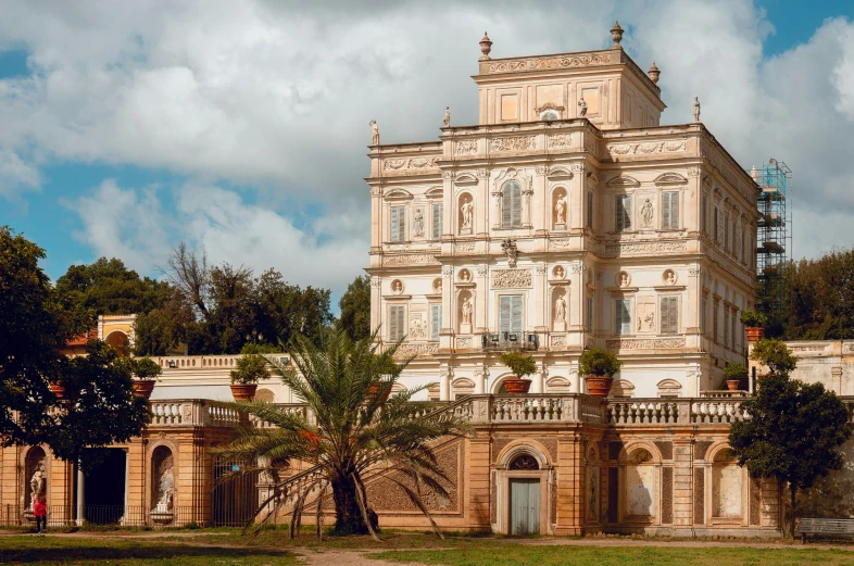 a very large house with lots of windows and a tower