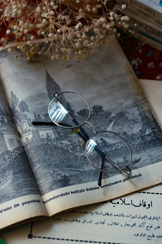 glasses resting on a pair of old reading glasses