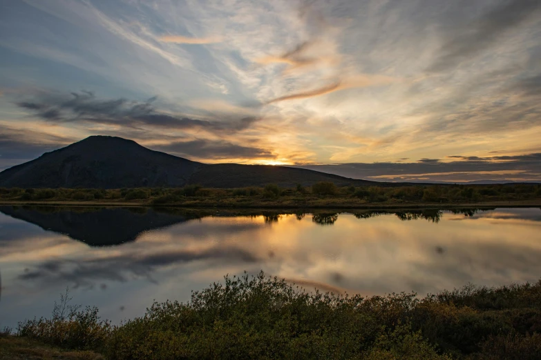 a mountain and lake are featured in this landscape po