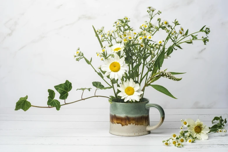 flowers are in a vase next to other flowers