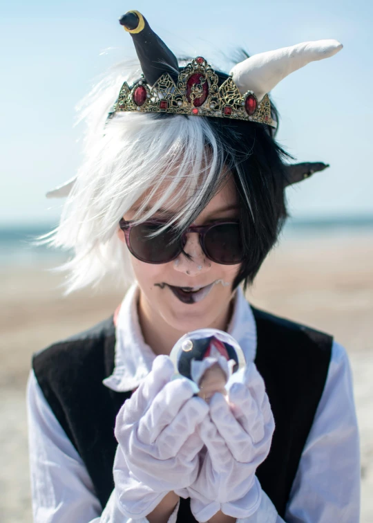 a girl with white hair and black sunglasses has a hat