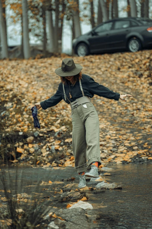 a young person with a hat riding on a skateboard