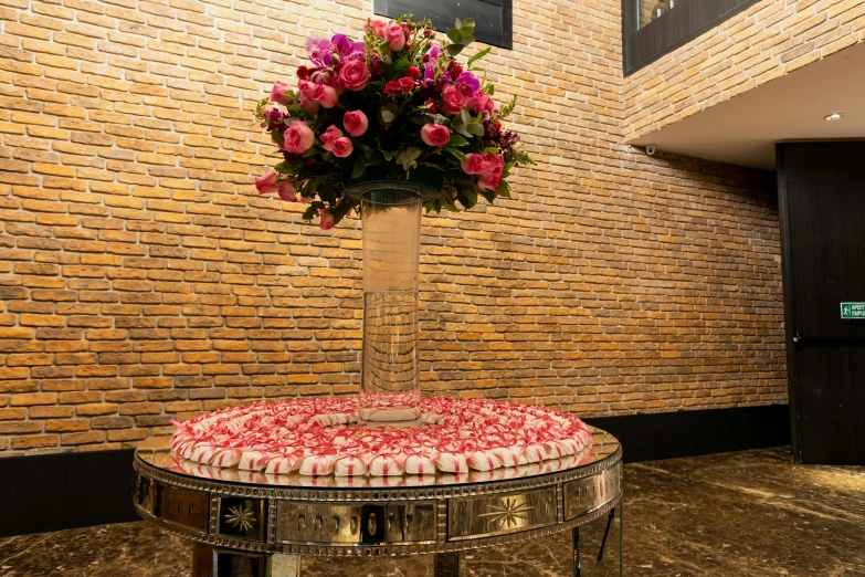 a table with cakes and flowers on top