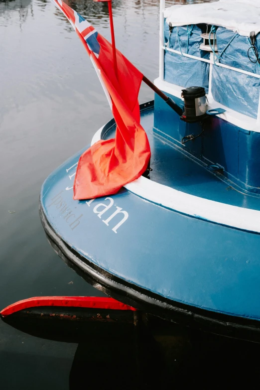 a boat with an umbrella in the water