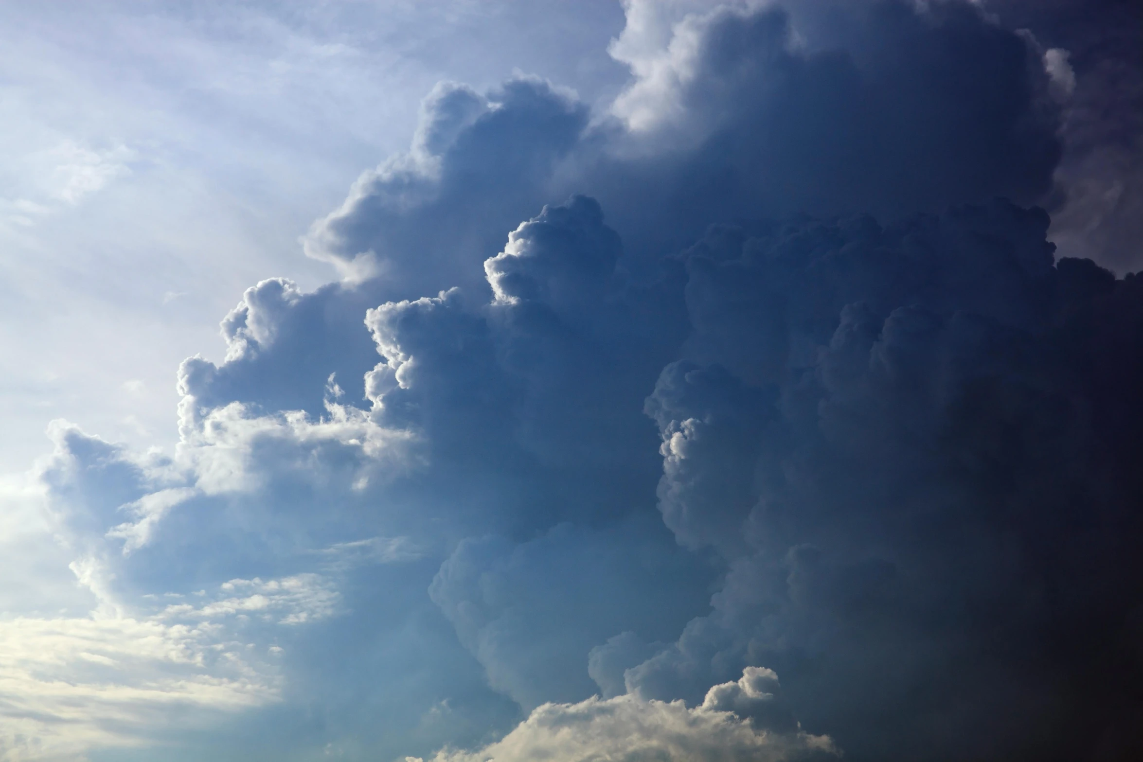 a large cloud of clouds over a train