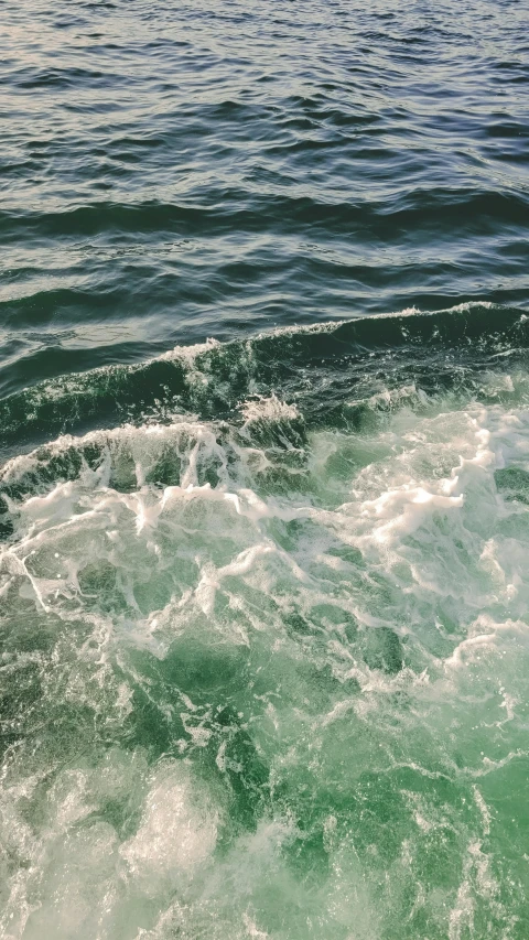 the surfer is riding in a large body of water