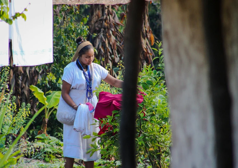 a woman holding a bag outside