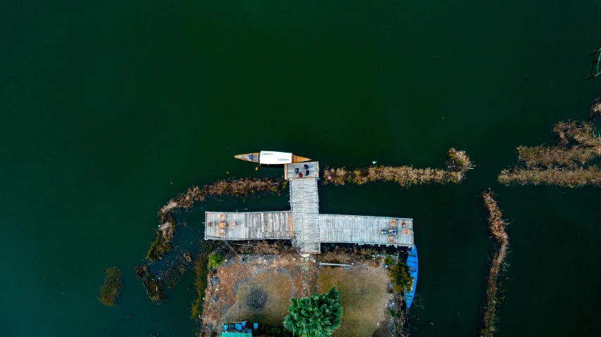 a lake dock next to a large body of water