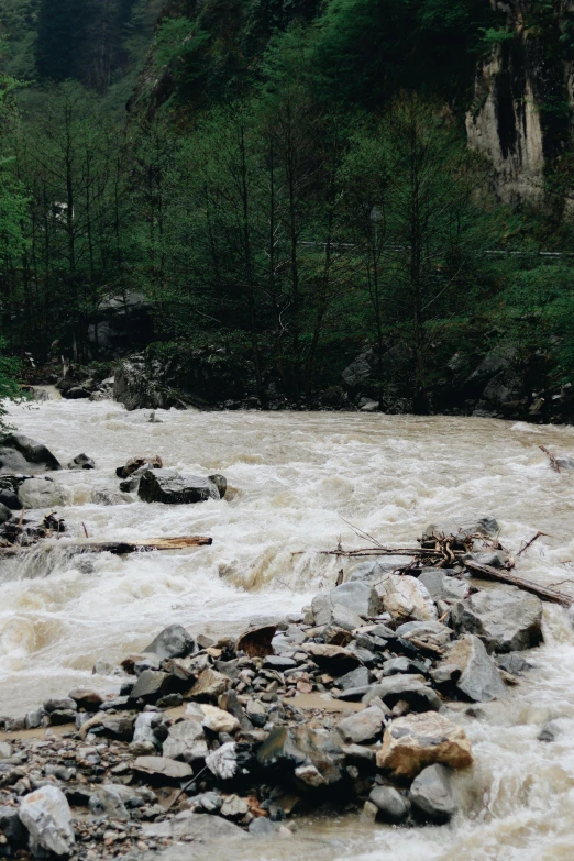 a man standing on a raft in a river