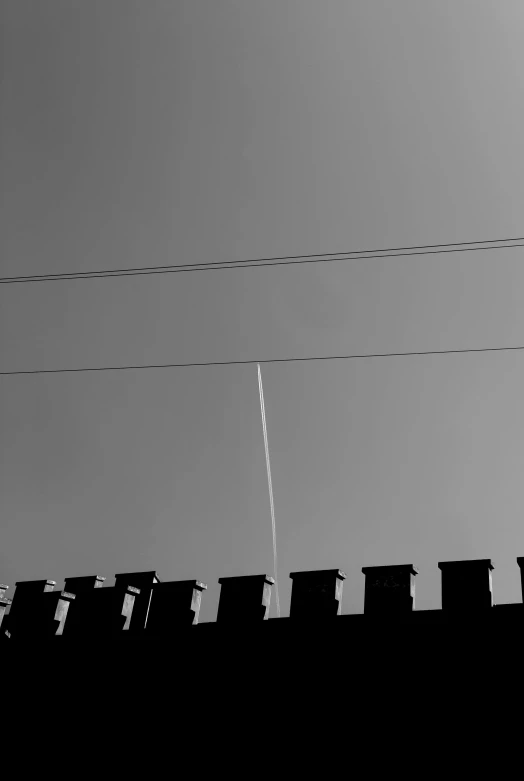 a telephone line with power lines and wires behind it