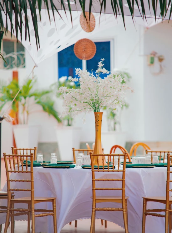 flowers in a tall vase on a table