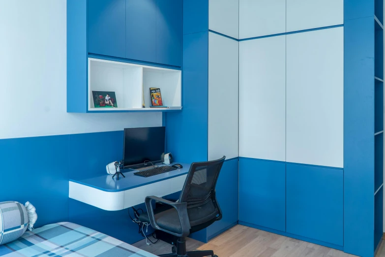 blue and white room with desk and chair