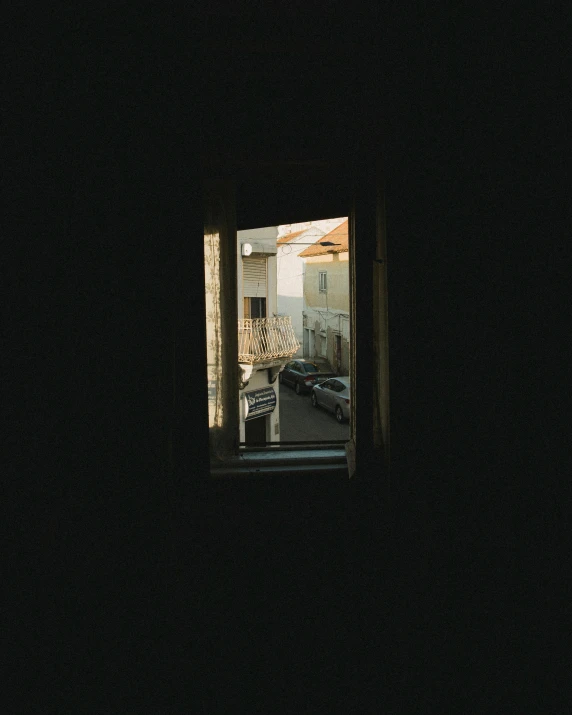 dark view of street seen from window inside building