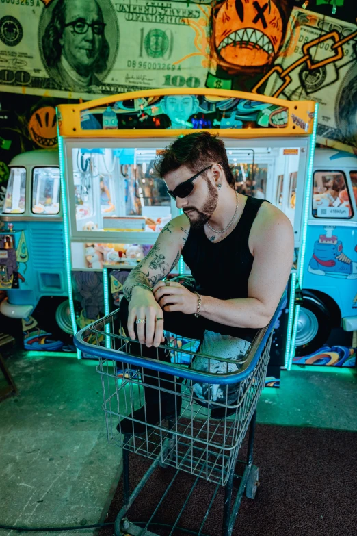 a man sitting in a cart looking at his cellphone