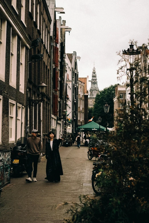 a couple standing together on the side walk