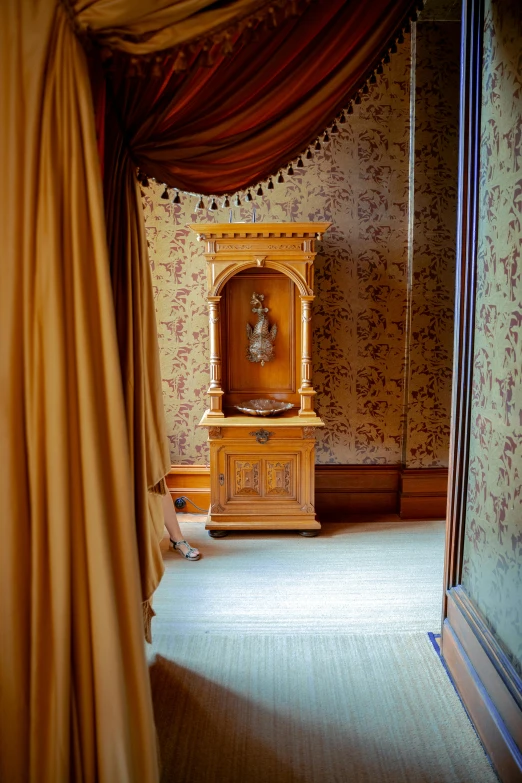 a room with a window and curtains and a clock on it