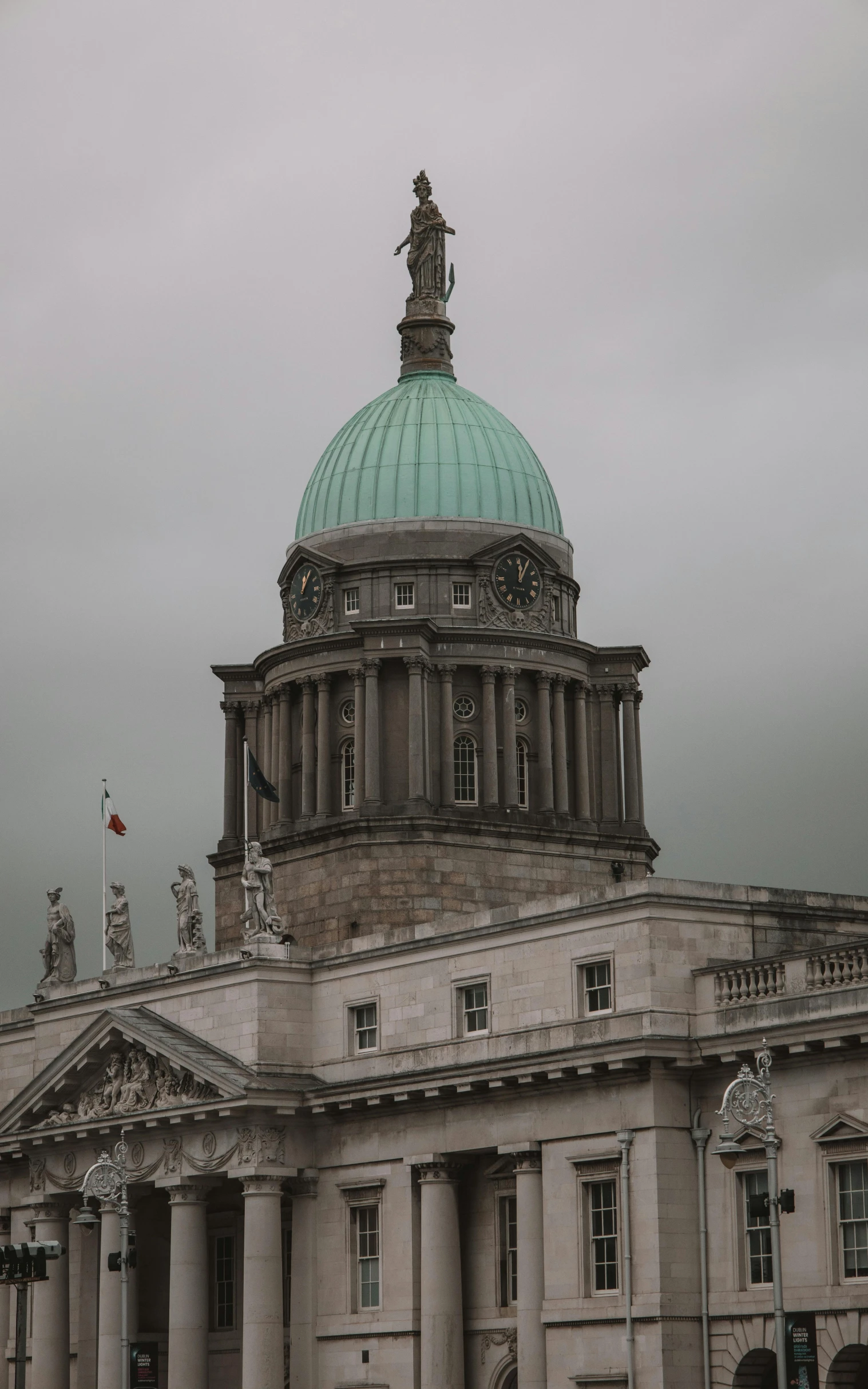 the dome of a building is adorned with statues