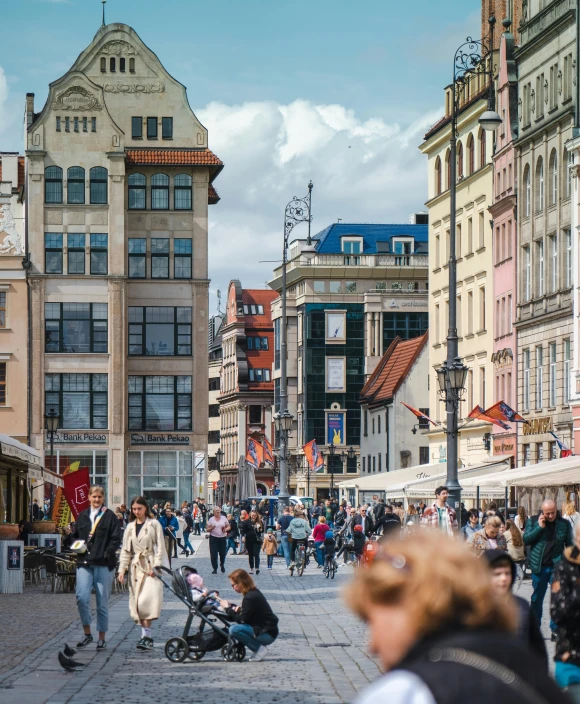 an old european city with many people walking