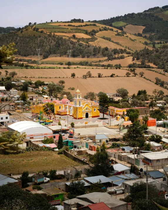 colorful town nestled below the mountains in mexico