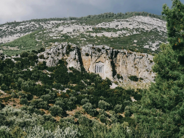 the mountain is covered in rocks and sp vegetation