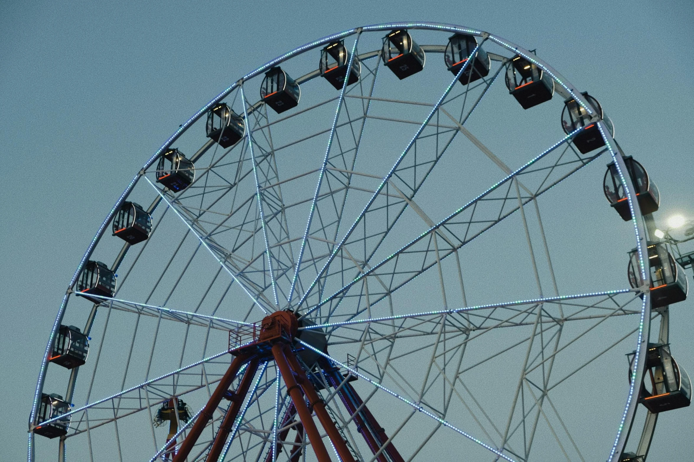 a ferris wheel in a park with bright lights