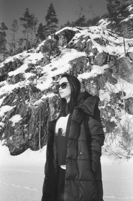 a woman in ski gear standing in the snow