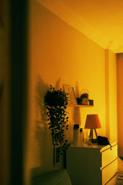 a bedroom with yellow light on the wall and floor