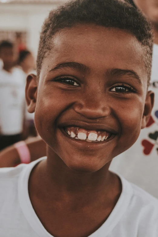 a little boy that has some kind of smile on his face