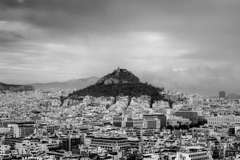 a mountain sits high above the city