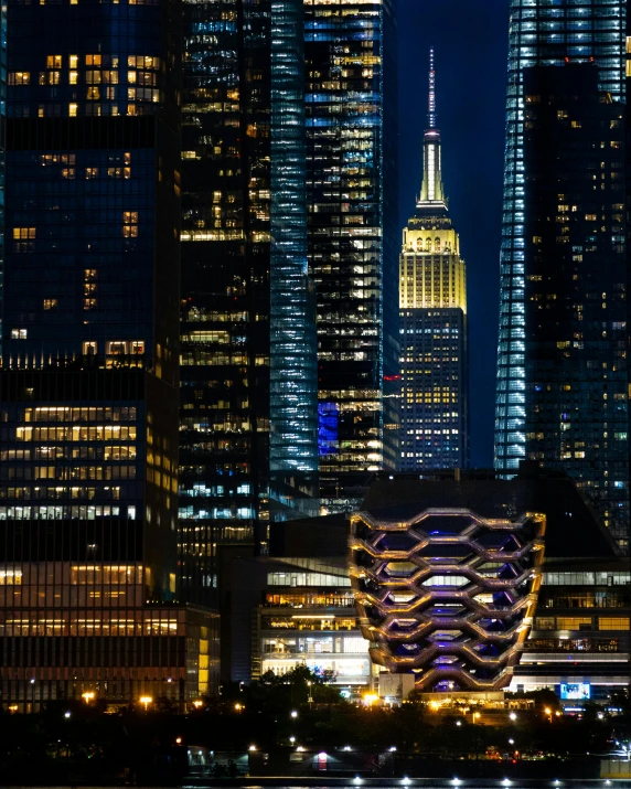 city buildings with lights on the tops during night