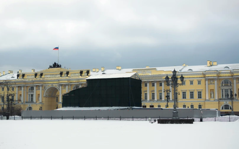 a large building with a flag on top of it