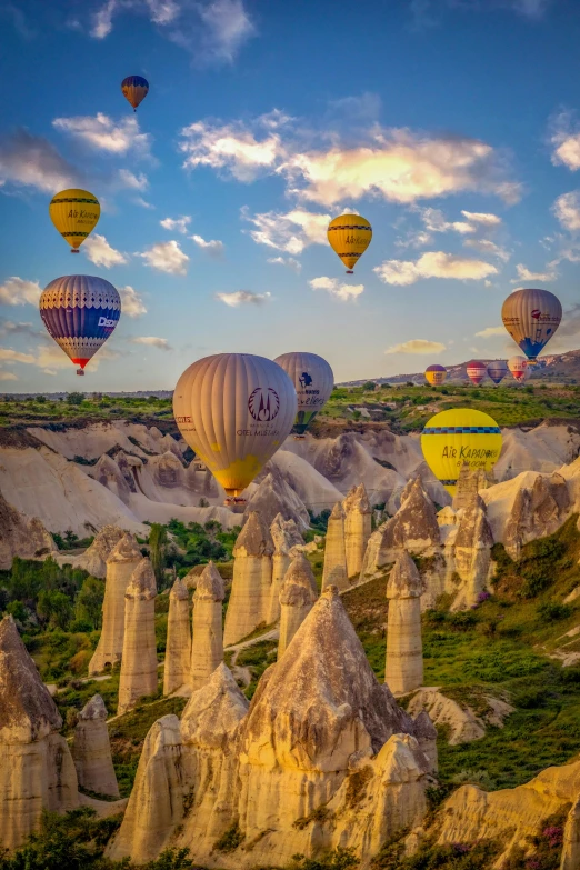 an up close picture of many  air balloons flying in the air