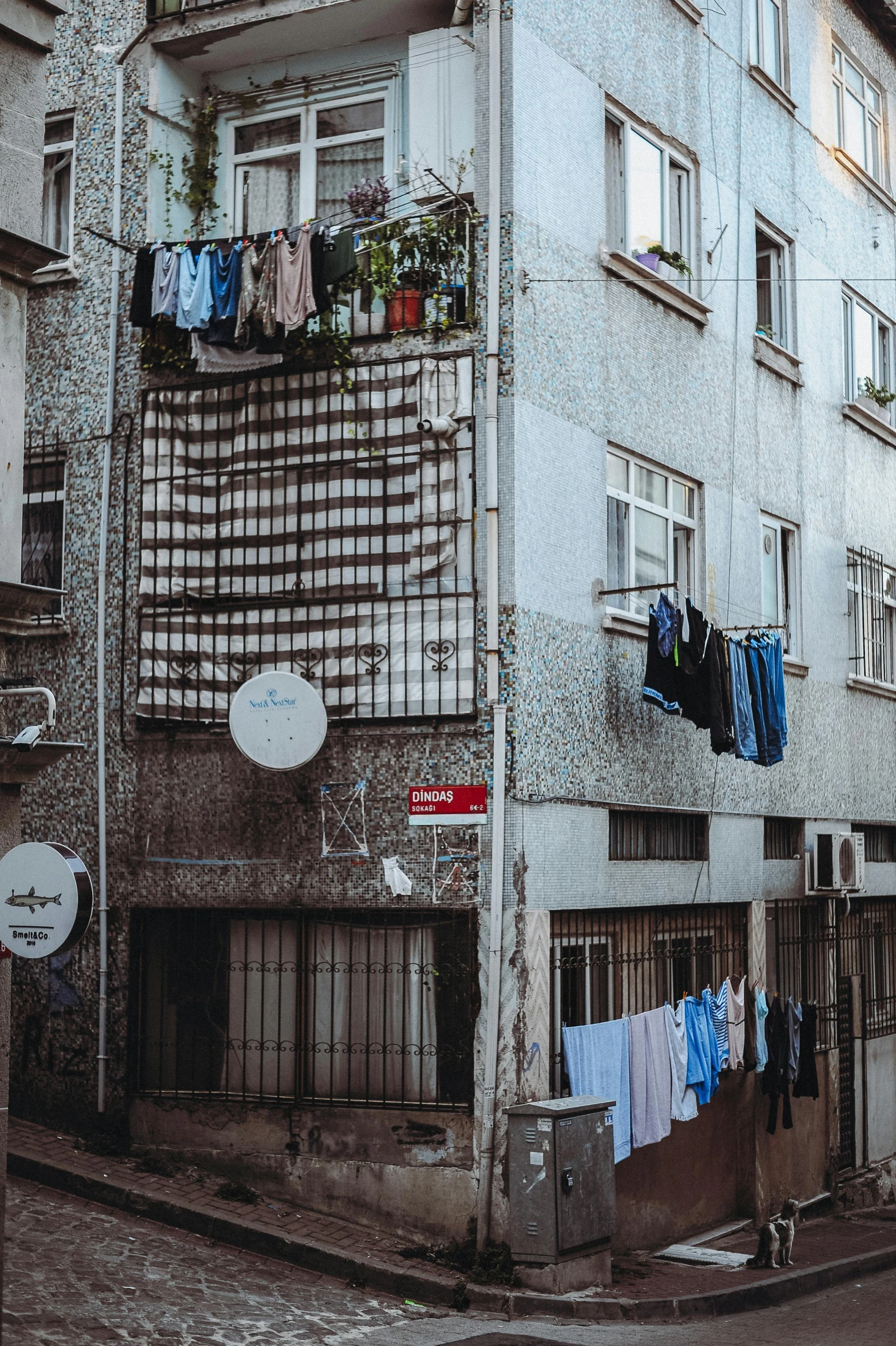 clothes are hung out to dry outside the windows