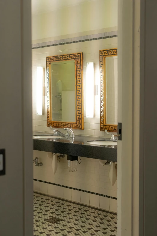 two sinks sit side by side in a rest room